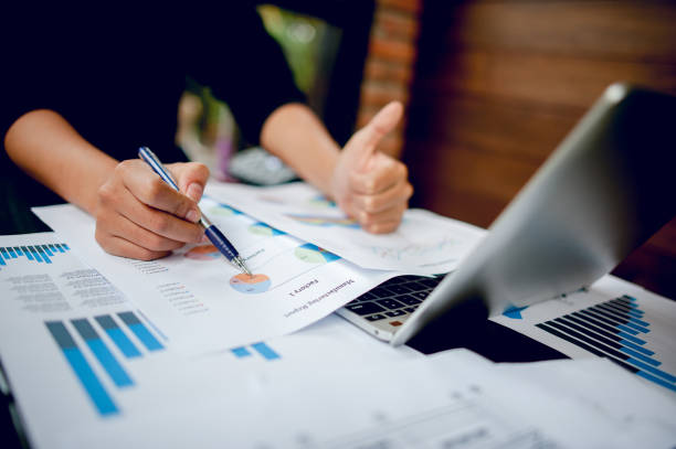 istock Businessman working at a computer office And graphs on his desk. Business ideas and space for copy. 1071409320