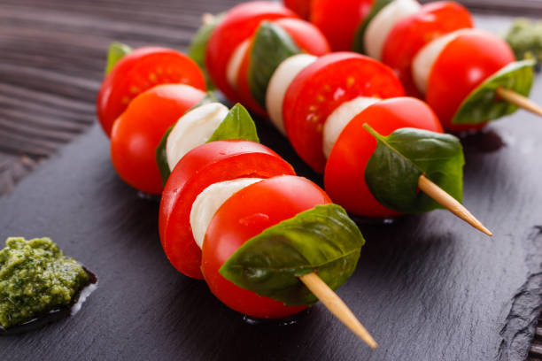 istock Caprese salad on a wooden rustic background 1071411960
