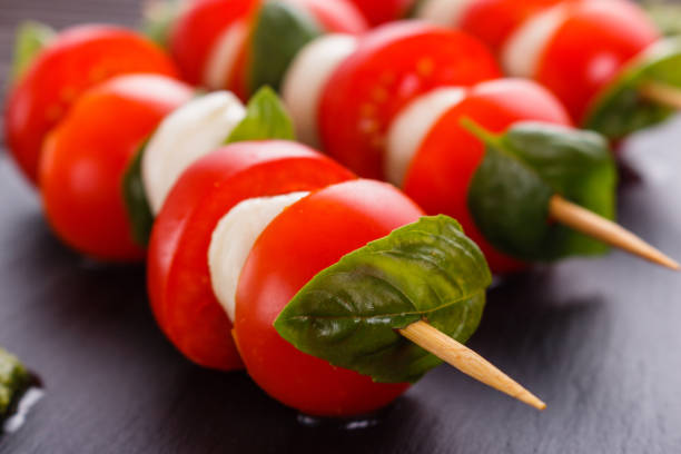 istock Caprese salad on a wooden rustic background 1071411978