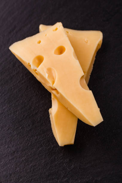 istock Piece and slices of cheese on a white background 1071414802