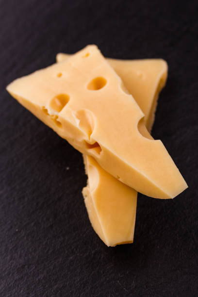 istock Piece and slices of cheese on a white background 1071414818