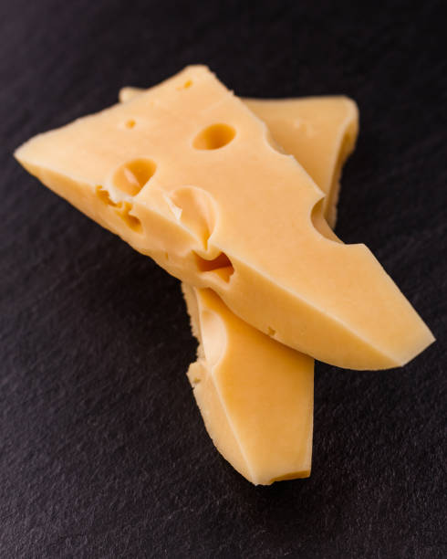 istock Piece and slices of cheese on a white background 1071414842