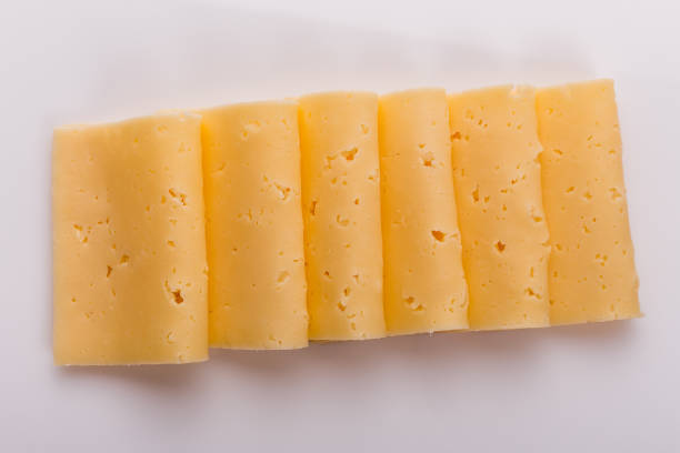 istock Piece and slices of cheese on a white background 1071414960