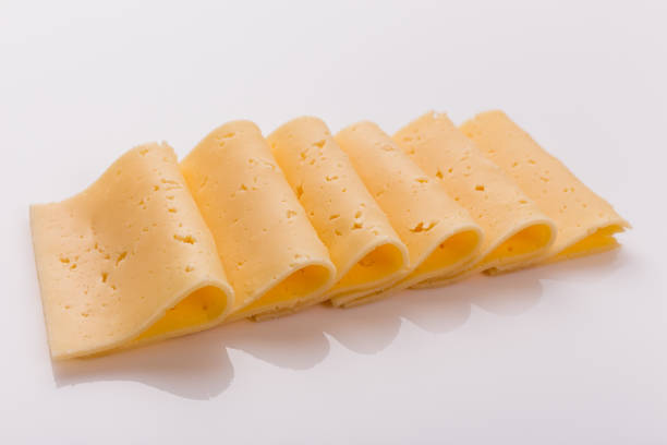 istock Piece and slices of cheese on a white background 1071414986