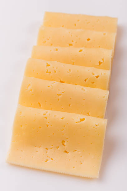 istock Piece and slices of cheese on a white background 1071415026