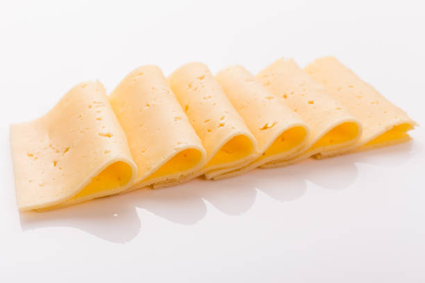 istock Piece and slices of cheese on a white background 1071415056