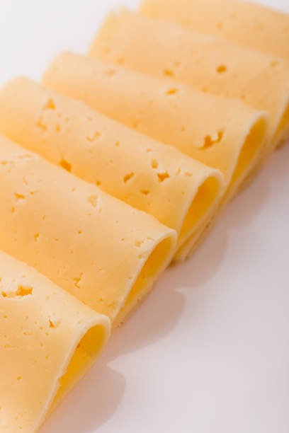 istock Piece and slices of cheese on a white background 1071415078