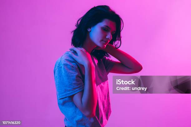 Portrait Of Beautiful Woman Pink Purple And Blue Light Colors Stock Photo - Download Image Now