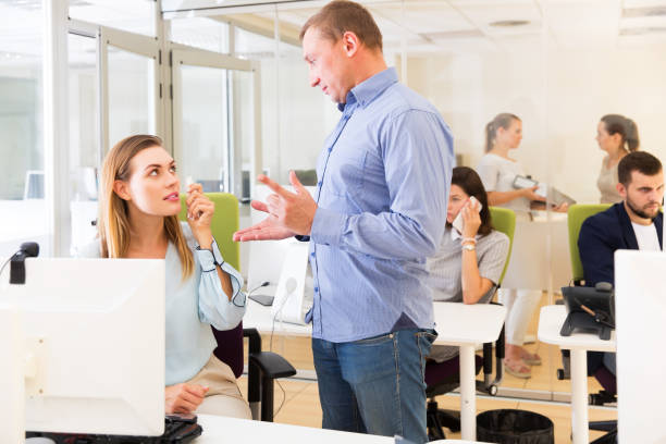 istock Dissatisfied manager talking to woman 1071418924