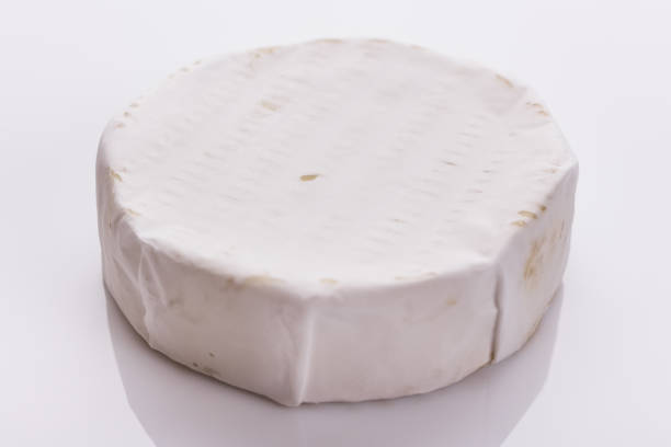 istock delicious creamy camembert cheese on a white background 1071419584