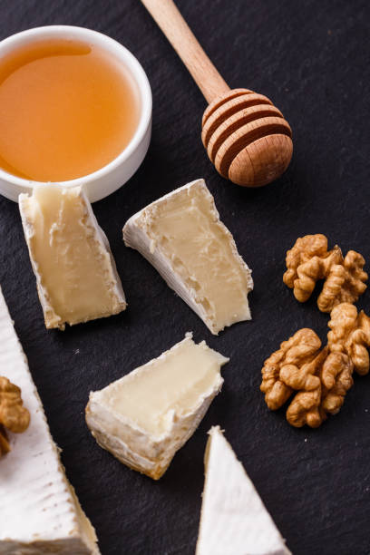 istock delicious creamy camembert cheese on a wooden rustic background 1071420086