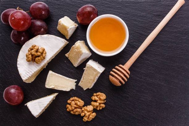 istock delicious creamy camembert cheese on a wooden rustic background 1071420180