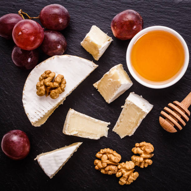 istock delicious creamy camembert cheese on a wooden rustic background 1071420292