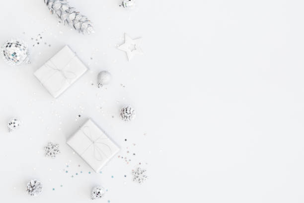 istock Christmas composition. Christmas gifts, silver decorations on pastel gray background. Flat lay, top view, copy space 1071429664