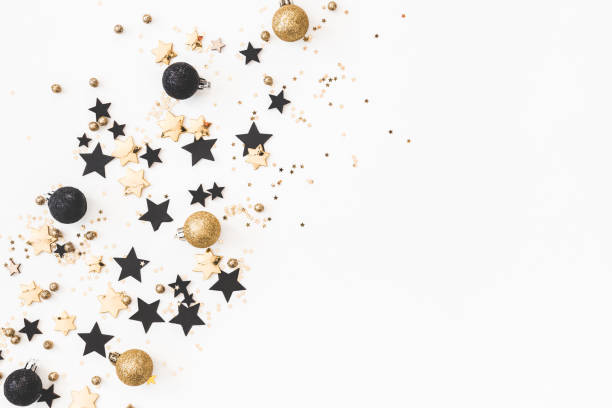 istock Christmas composition. Christmas golden and black decorations on white background. Flat lay, top view, copy space 1071430176
