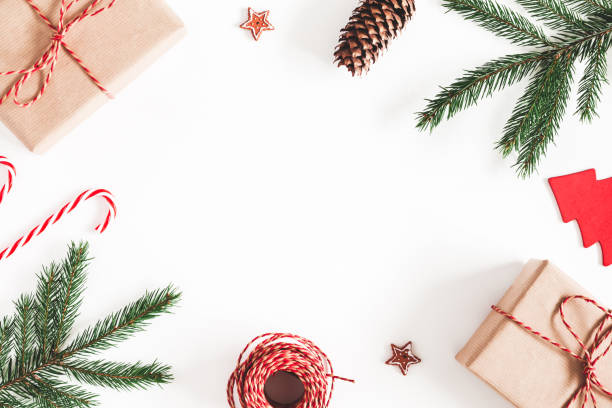 istock Christmas composition. Christmas gifts, fir tree branches, decorations on white background. Flat lay, top view, copy space 1071430270