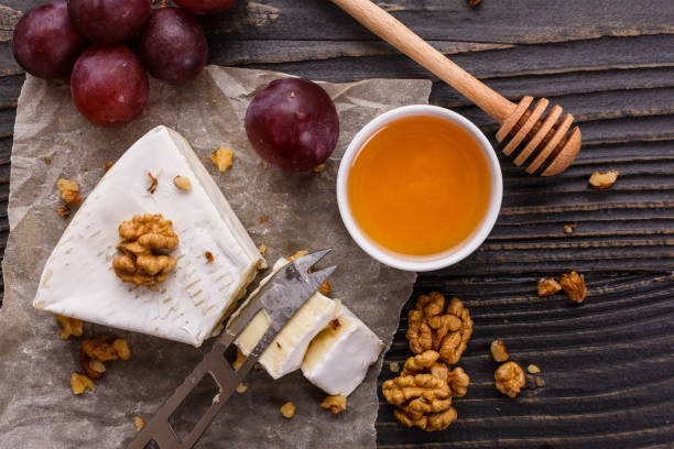 istock delicious creamy camembert cheese on a wooden rustic background 1071430290