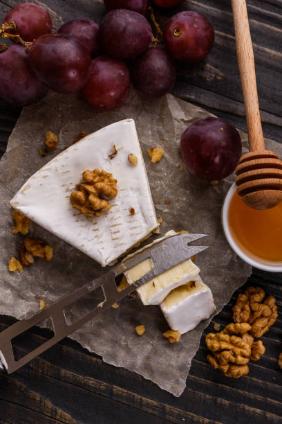 istock delicious creamy camembert cheese on a wooden rustic background 1071430624