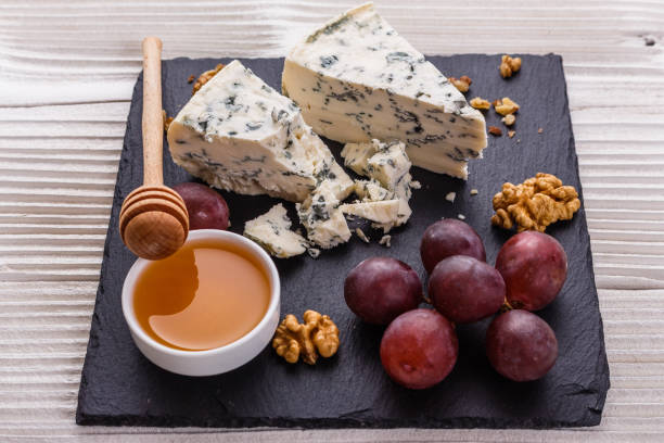 istock delicious blue cheese on wooden rustic background 1071431294