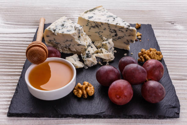 istock delicious blue cheese on wooden rustic background 1071431322