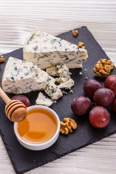 istock delicious blue cheese on wooden rustic background 1071431444