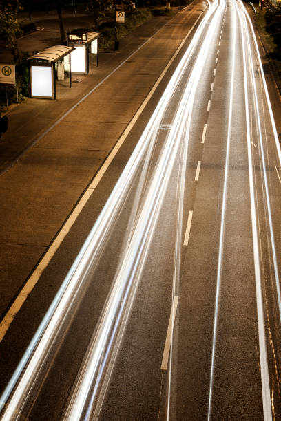 istock Bus stop and road at night 1071432830