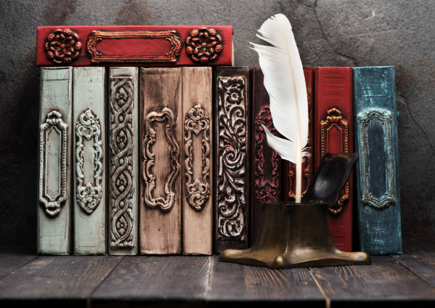 istock Ancient books on shelf and antique inkwell with feather 1071432860