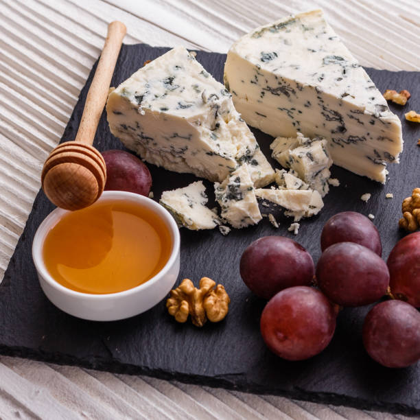 istock delicious blue cheese on wooden rustic background 1071440976