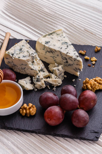 istock delicious blue cheese on wooden rustic background 1071441030