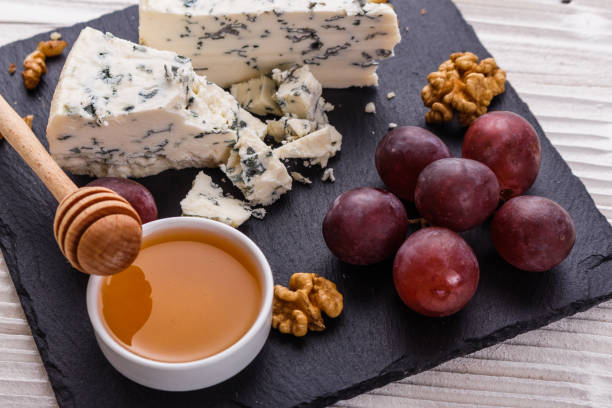 istock delicious blue cheese on wooden rustic background 1071441152