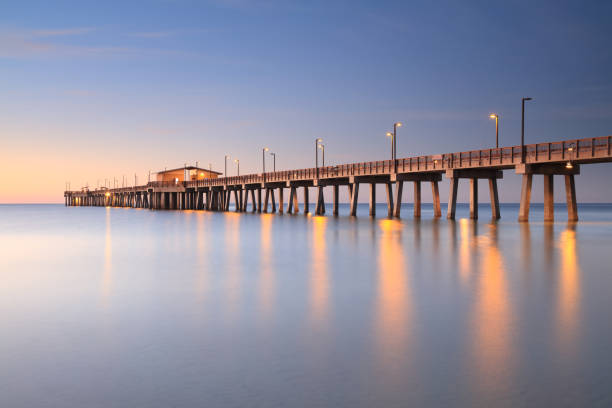 Pier, Gulf Shores, Alabama Fishing pier at sunset, Gulf Shores, Alabama gulf coast states stock pictures, royalty-free photos & images