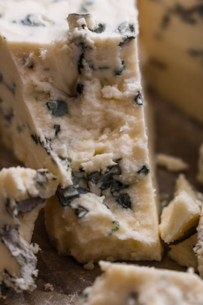 istock delicious blue cheese on wooden rustic background 1071441964