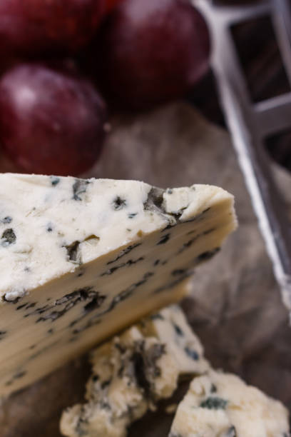 istock delicious blue cheese on wooden rustic background 1071442034