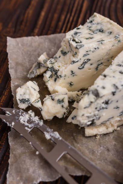 istock delicious blue cheese on wooden rustic background 1071442164