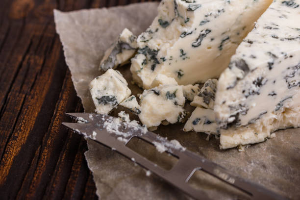 istock delicious blue cheese on wooden rustic background 1071442226
