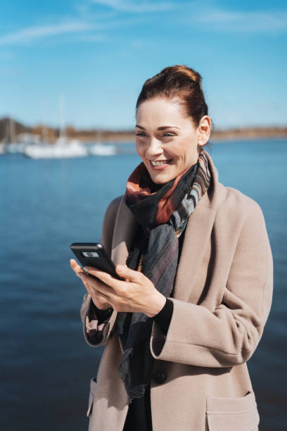 istock Beautiful smiling woman at the seaside 1071444908