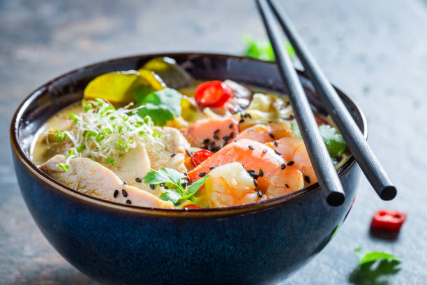 istock Malaysian Soup with coconut milk and prawn on concrete table 1071448512