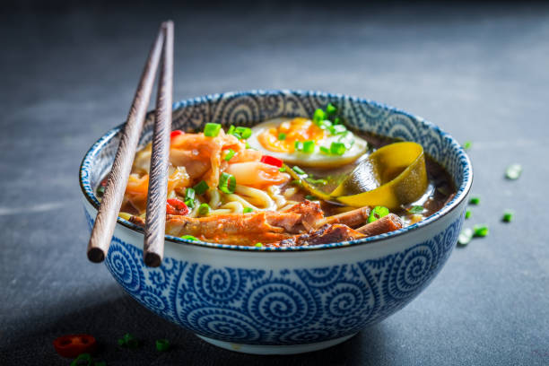 istock Kiimchi soup with chive and noodles on concrete table 1071448664