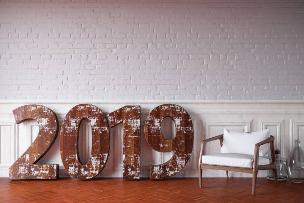istock 2019 Text Against Brick Wall with Chair 1071456348