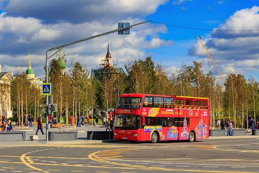 Moscow, Russia - September 30, 2018: Double decker tourist bus on the background of Zaryadye Park near Moscow Kremlin on a sunny autumn day