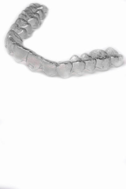istock Invisible dental teeth brackets tooth aligners plastic braces dentistry retainers to straighten teeth. Orthodontic temporary removable straighteners in dentist office dental surgery clinic. 1071457622