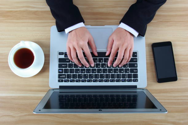 istock Businesswoman typing with laptop 1071457688