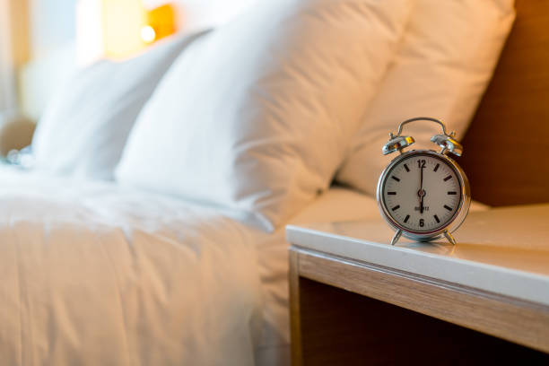 istock Metal Alarm clock on white bedroom 1071458140