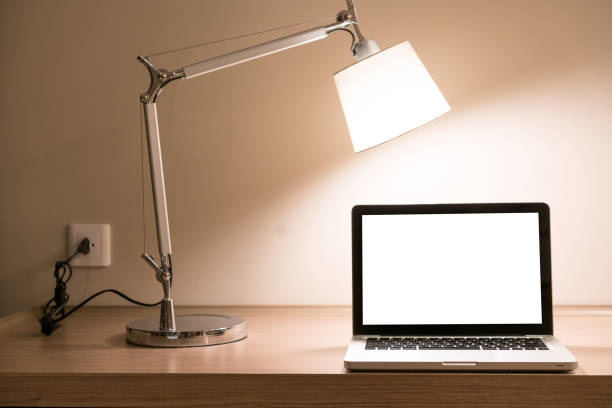 istock Laptop on a desk with lamp 1071458146