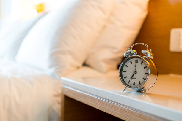 istock Metal Alarm clock on white bedroom 1071458174
