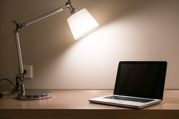 istock Laptop on a desk with lamp 1071458368