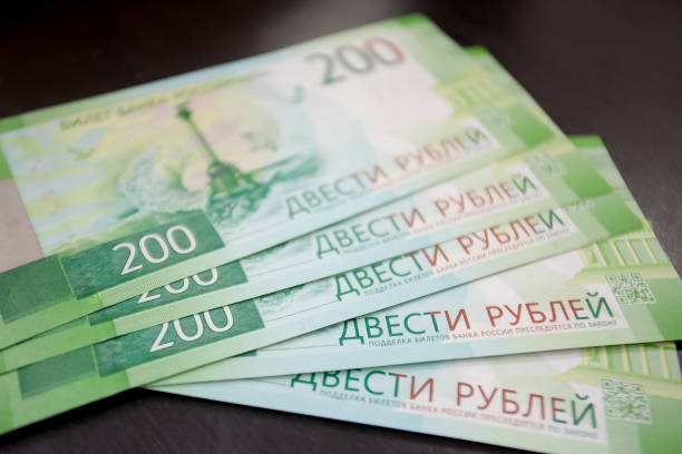 istock Russian money in the hand on a gray background. 1071459754