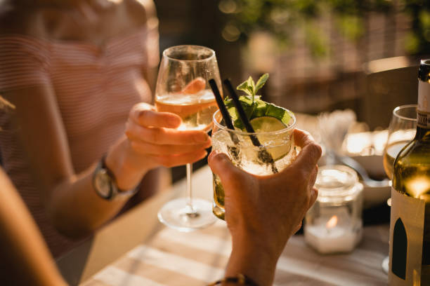 making a celebratory toast - cocktail drinking straw ice glass imagens e fotografias de stock