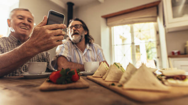 istock Senior men making a video chat on smartphone 1071465470