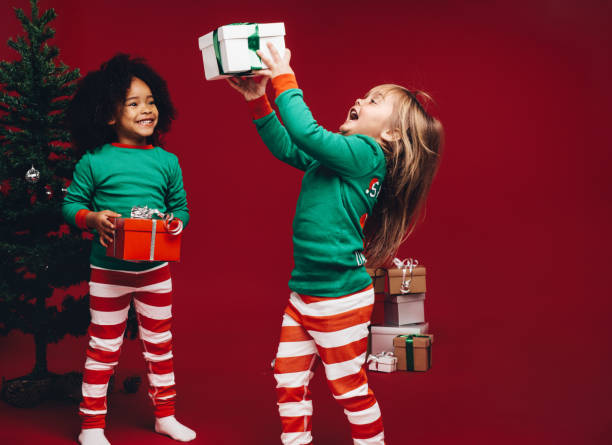 istock Kids playing with their christmas gifts 1071468820